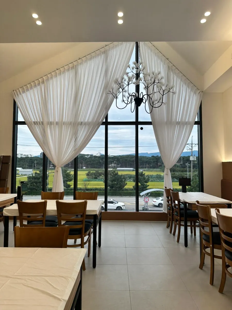 2nd floor seating with scenery visible through the curtains