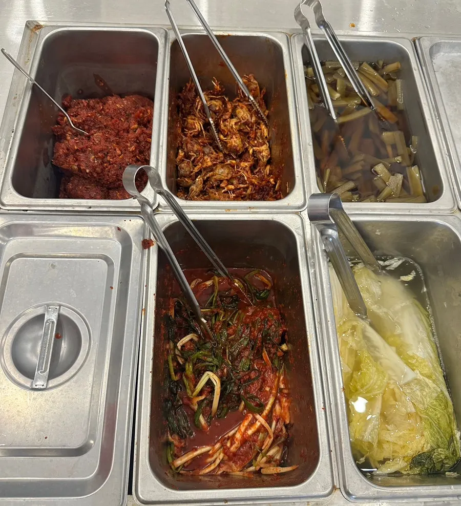 Extra side dishes including green onion kimchi