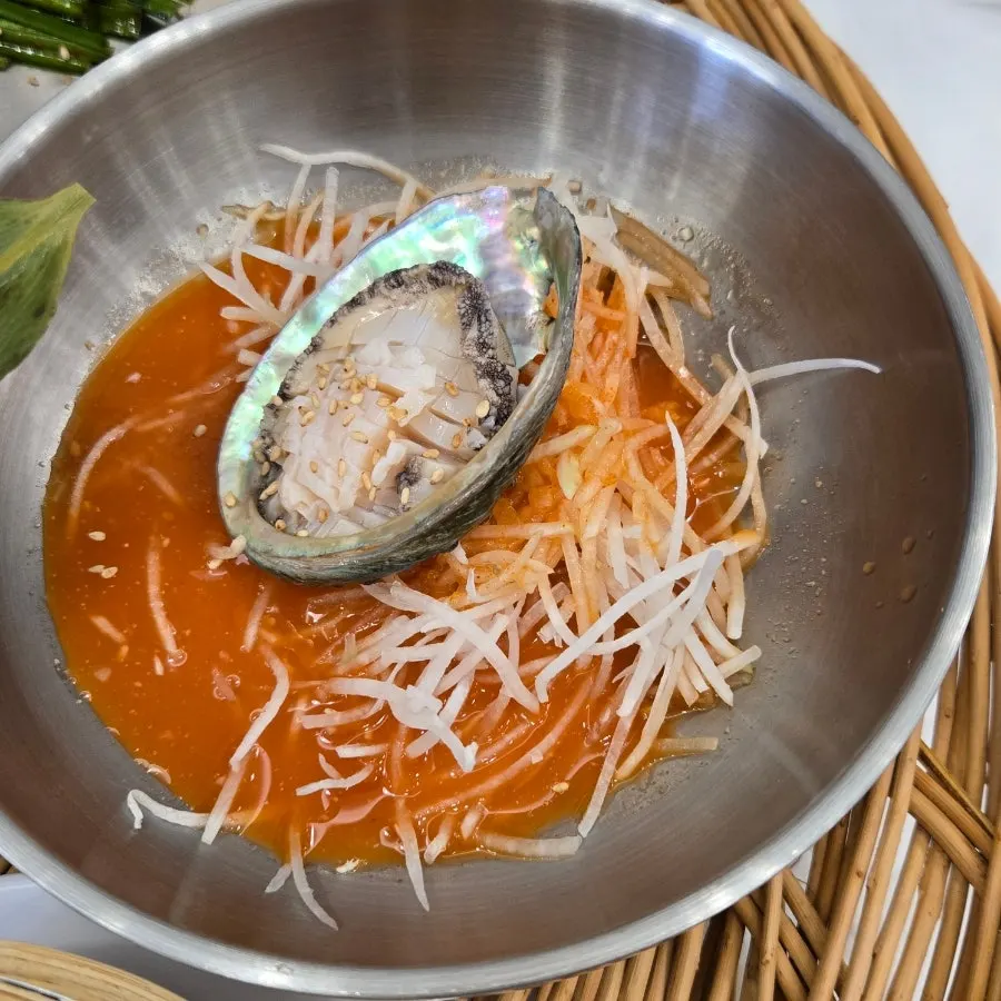Bowl of mulhoe with vegetables and seafood