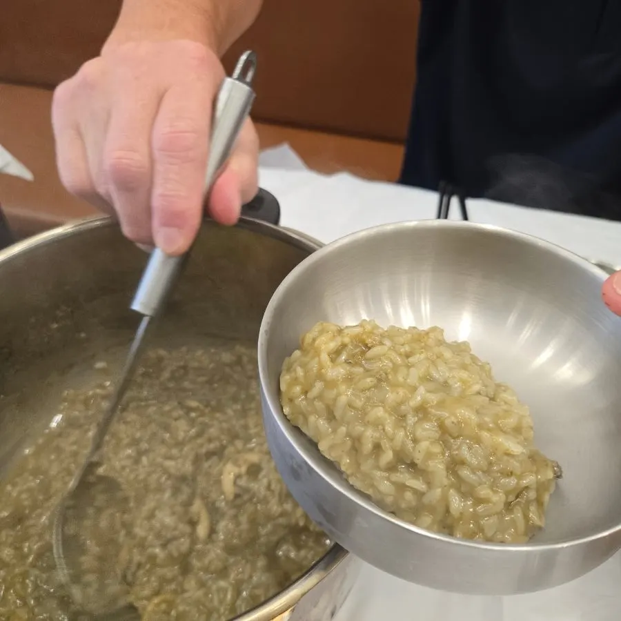 Close-up of abalone porridge packed with abalone