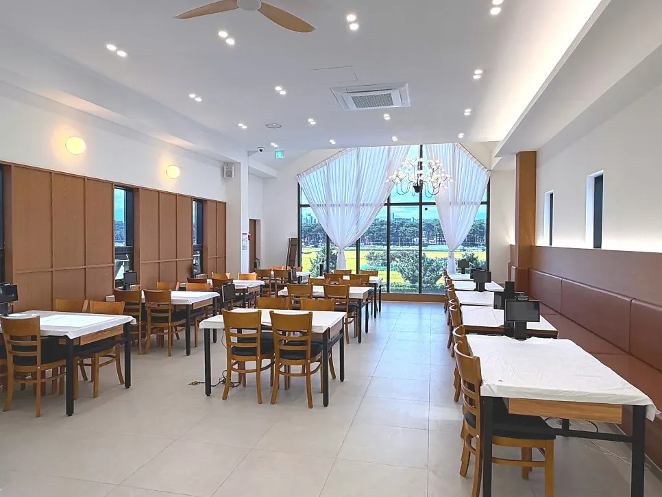 2nd-floor hall with natural light from a large window
