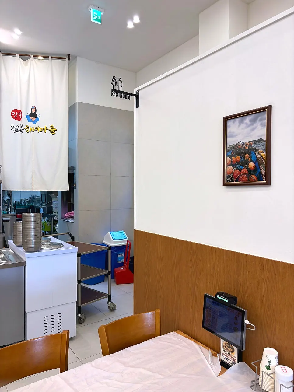 Restroom entrance next to the self-service corner