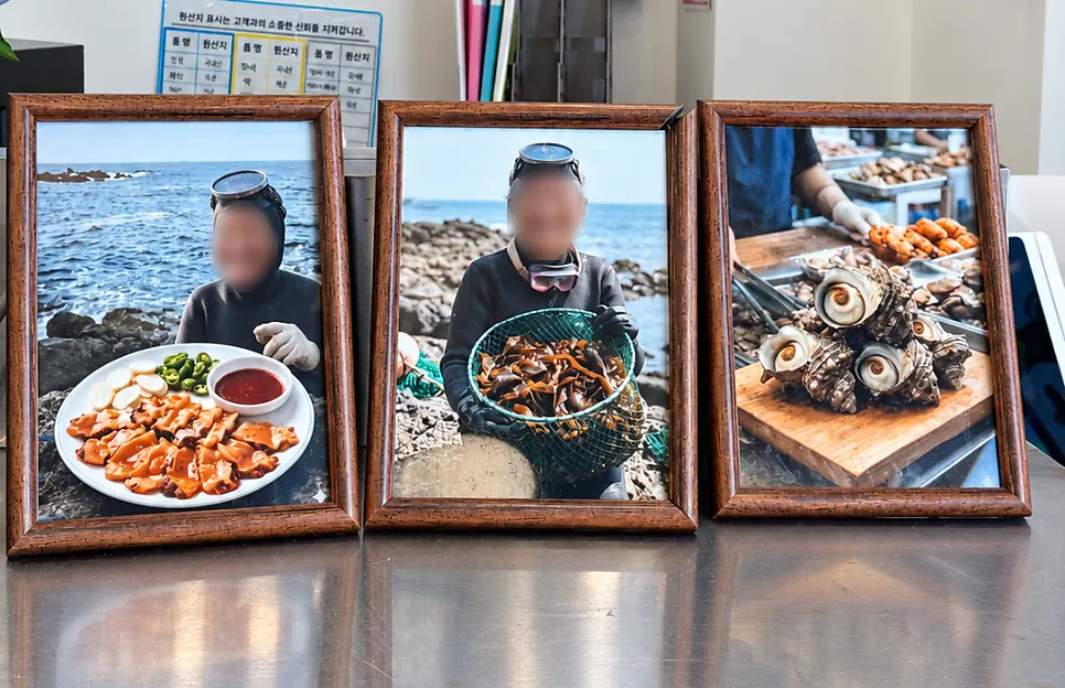Photos of the haenyeo divers hanging near the entrance