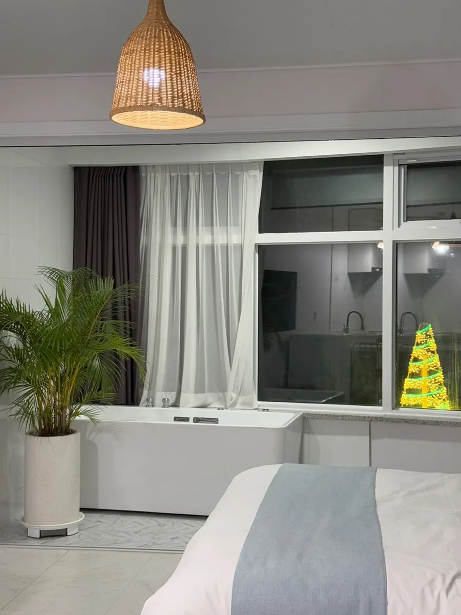 Bed and bright interior atmosphere of Room 401