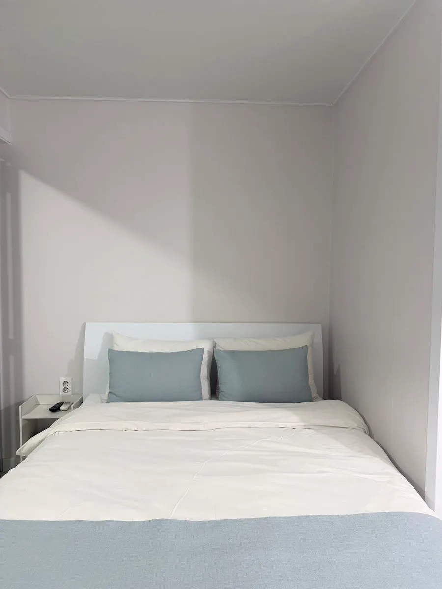 Interior of Room 401 with the sea visible through the window