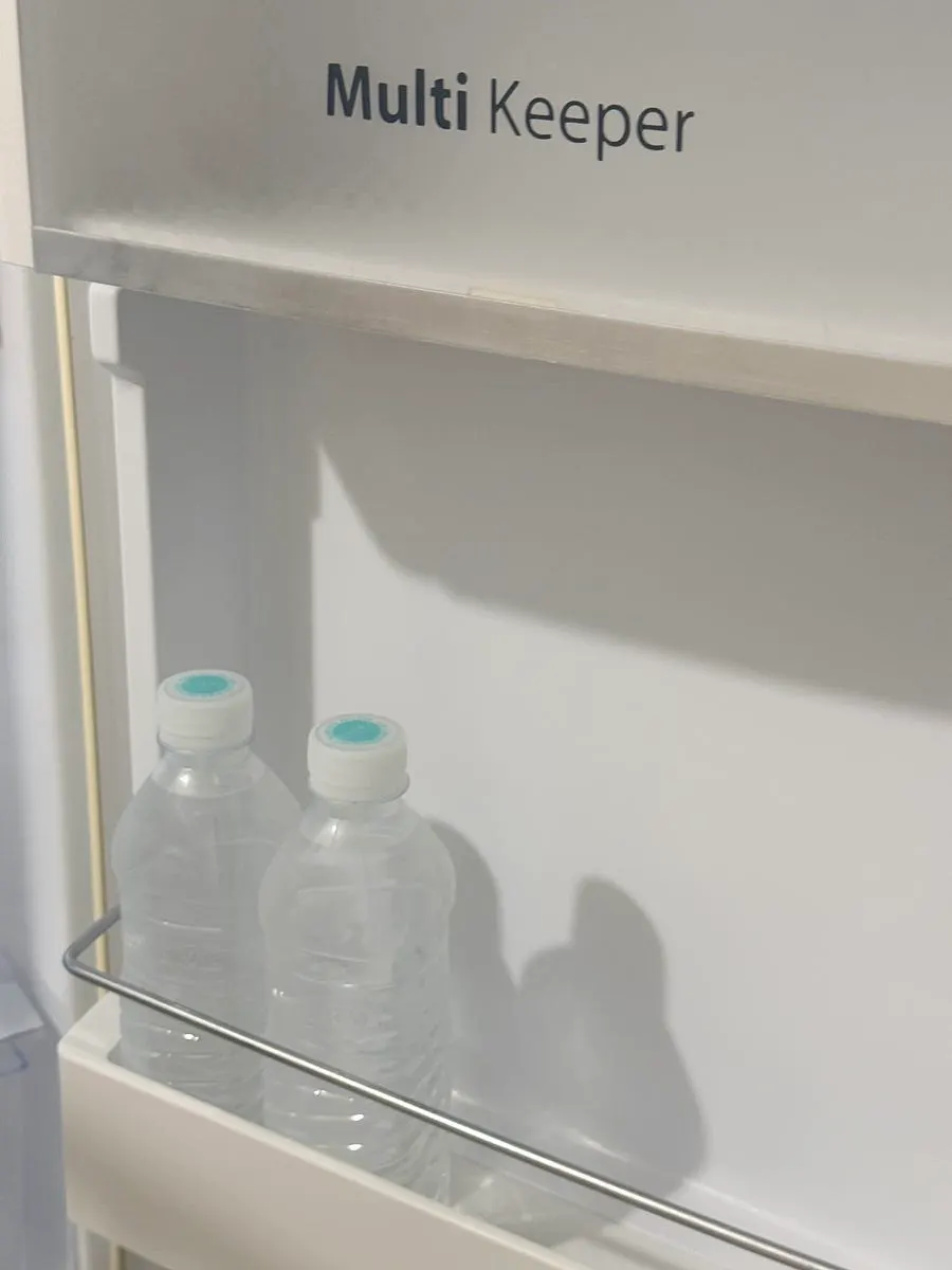 Free bottled water and fridge interior prepared in the room
