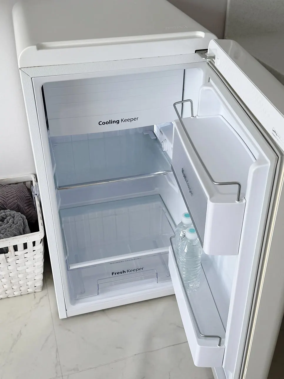Simple cooking appliances and kitchen space provided in the room