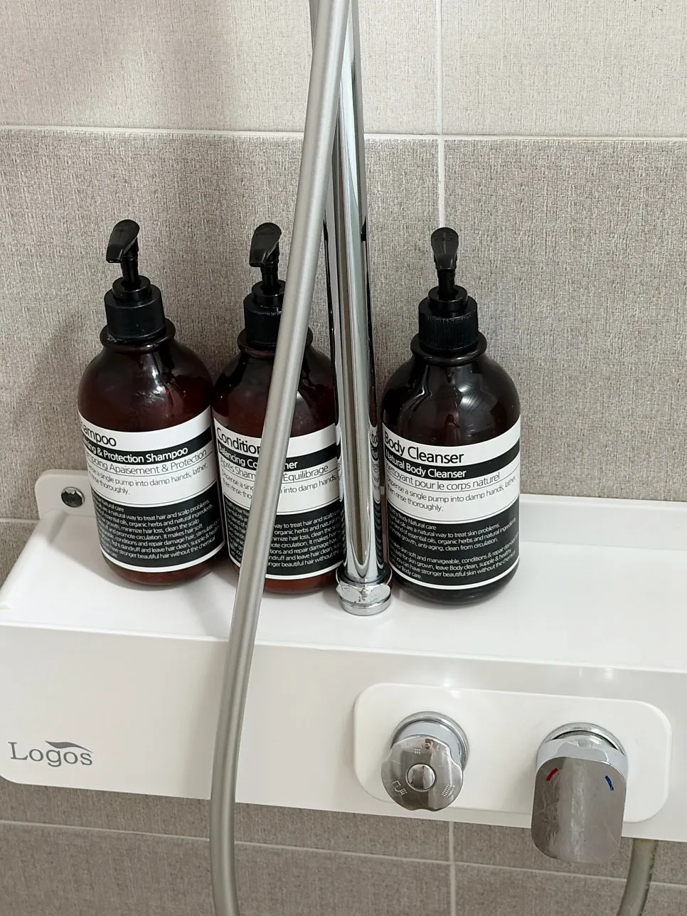 Shampoo, conditioner and body wash provided on the bathroom shelf