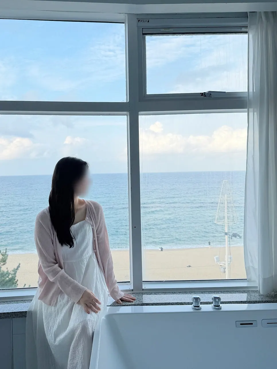 A shot taken at the room's photo zone with the sea as backdrop