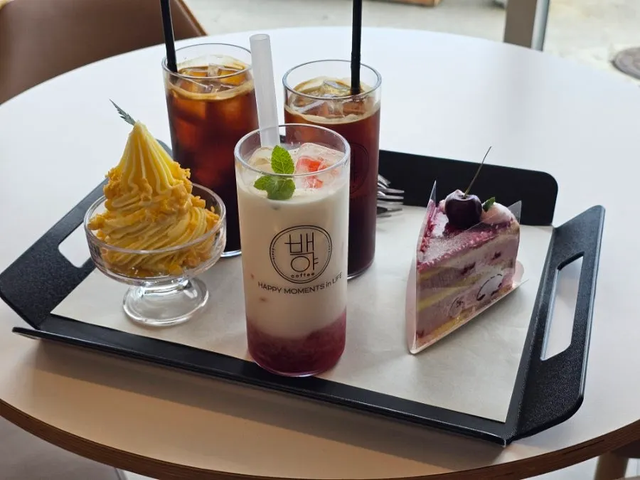 Four ordered items on the window-side table