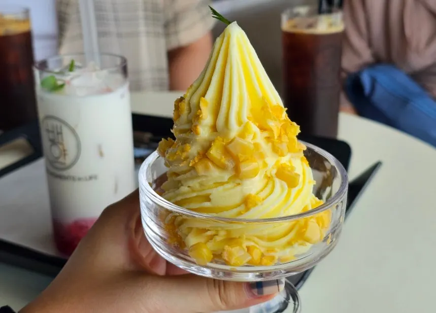 Oksigi corn ice cream topped with cereal and corn kernels
