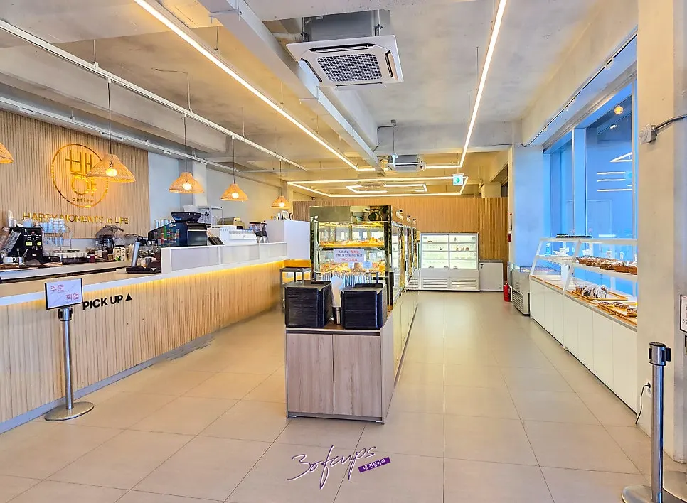 Indoor seating and stairwell view at Baegya Coffee