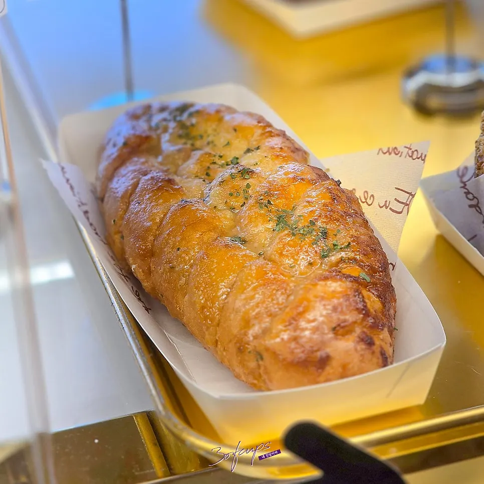 Meal-worthy bread display at Baegya Coffee