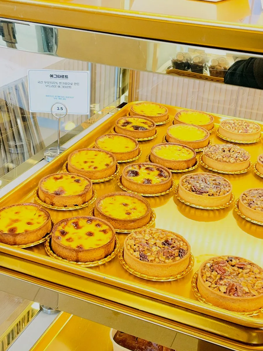 A variety of breads displayed behind glass doors
