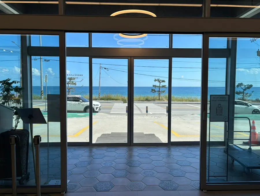 Exterior of Baegya Coffee on Haean-ro in Gangneung with the sea in view