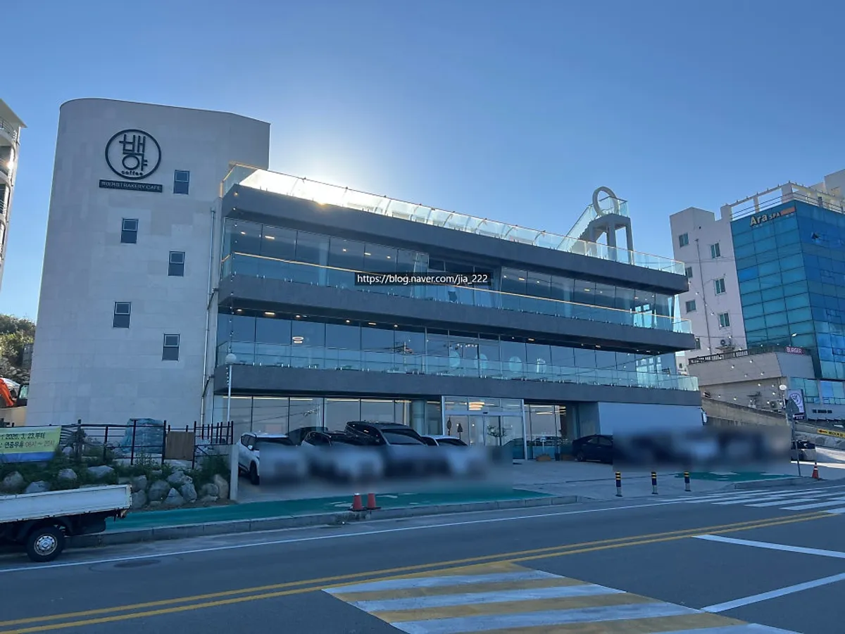 Full exterior view of the large Baegya Coffee building in Gangneung