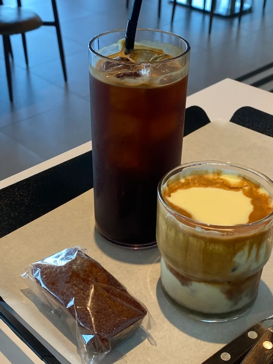 Glass of the signature iced corn cream shot latte