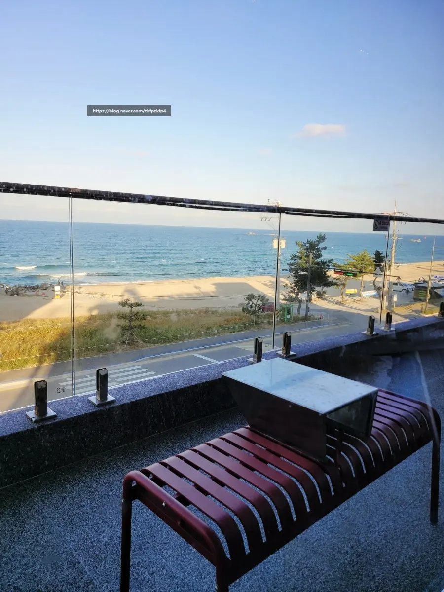 Ocean view seen from a window seat at Baegya Coffee