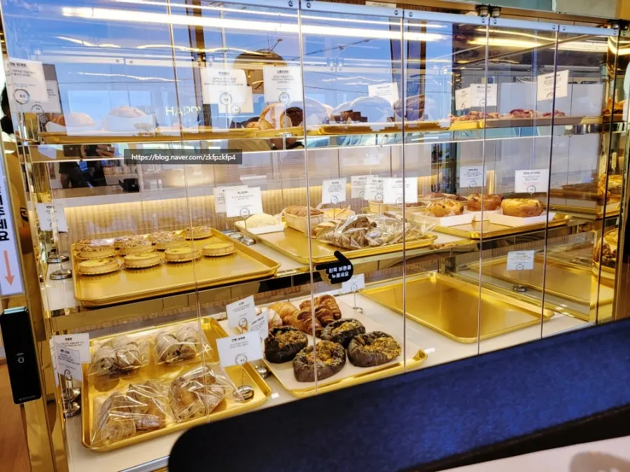 Bread display case with many varieties at Baegya Coffee