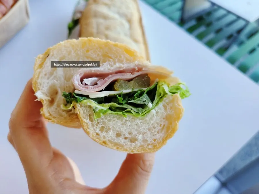 French reserve sandwich and iced Americano set on a table