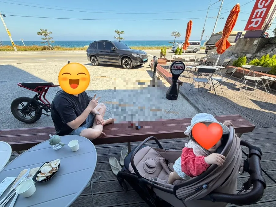 Burger Bar's outdoor terrace seating looking out at the sea