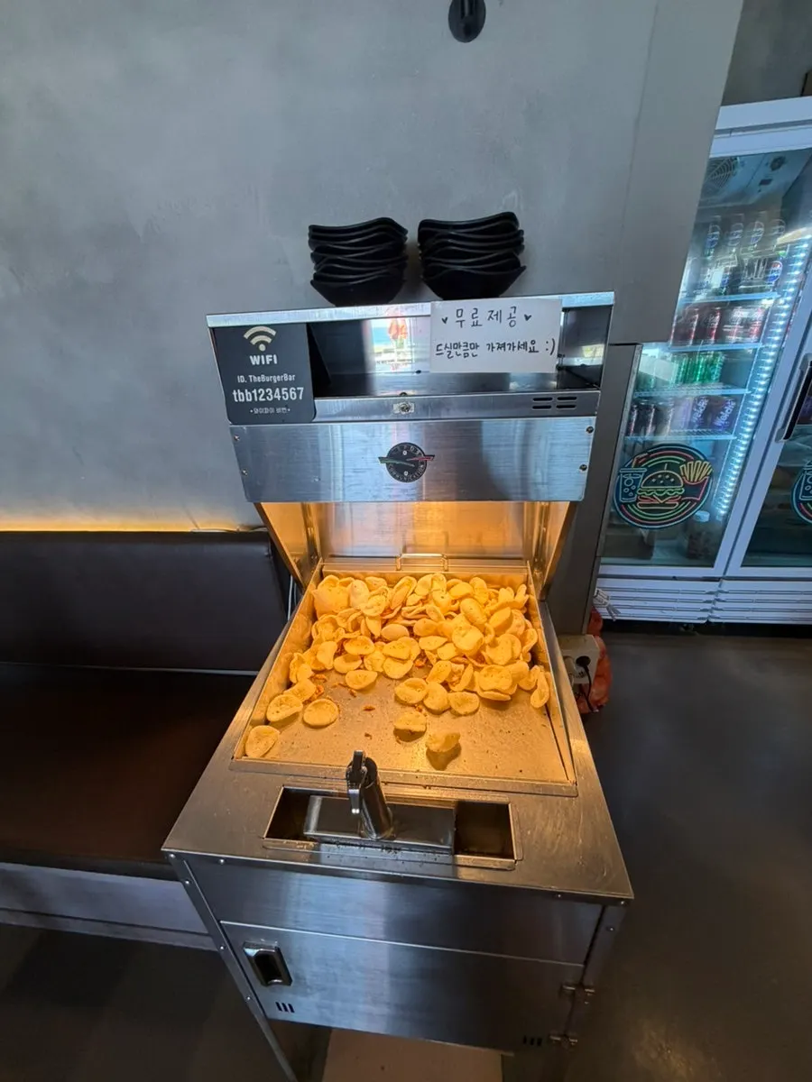 Burger Bar's self bar with forks, knives, and wet wipes