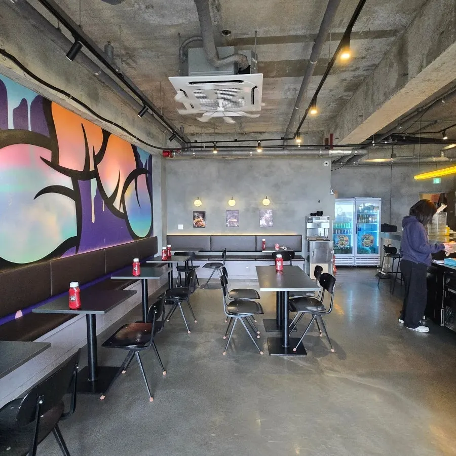 Exposed concrete interior of Burger Bar