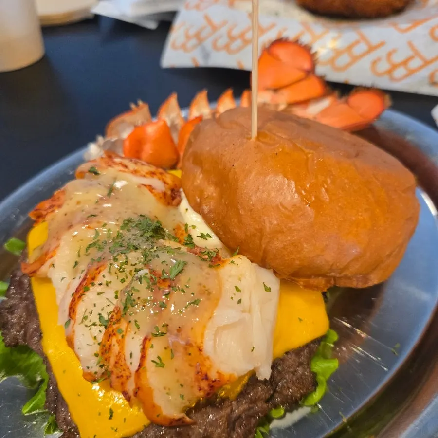 Burger Bar's lobster burger served with a lobster tail on the side
