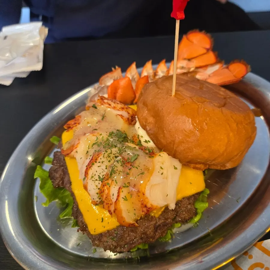 Cross-section of the lobster burger showing a large chunk of lobster meat