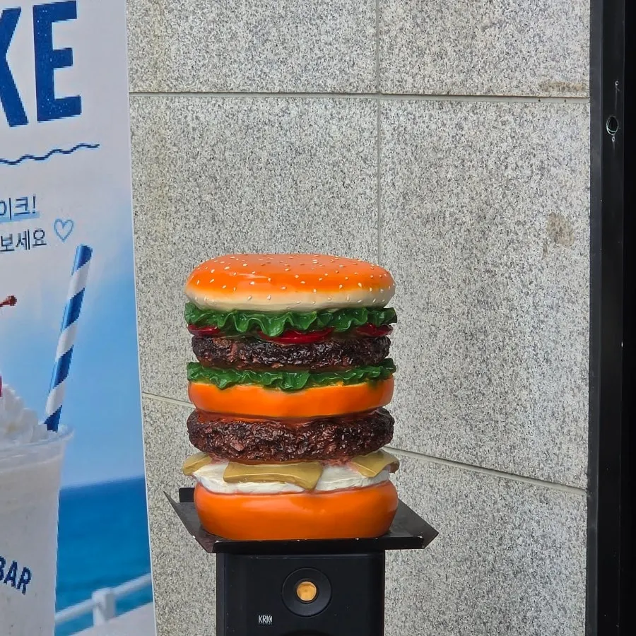 Outdoor sign displaying Burger Bar's award record