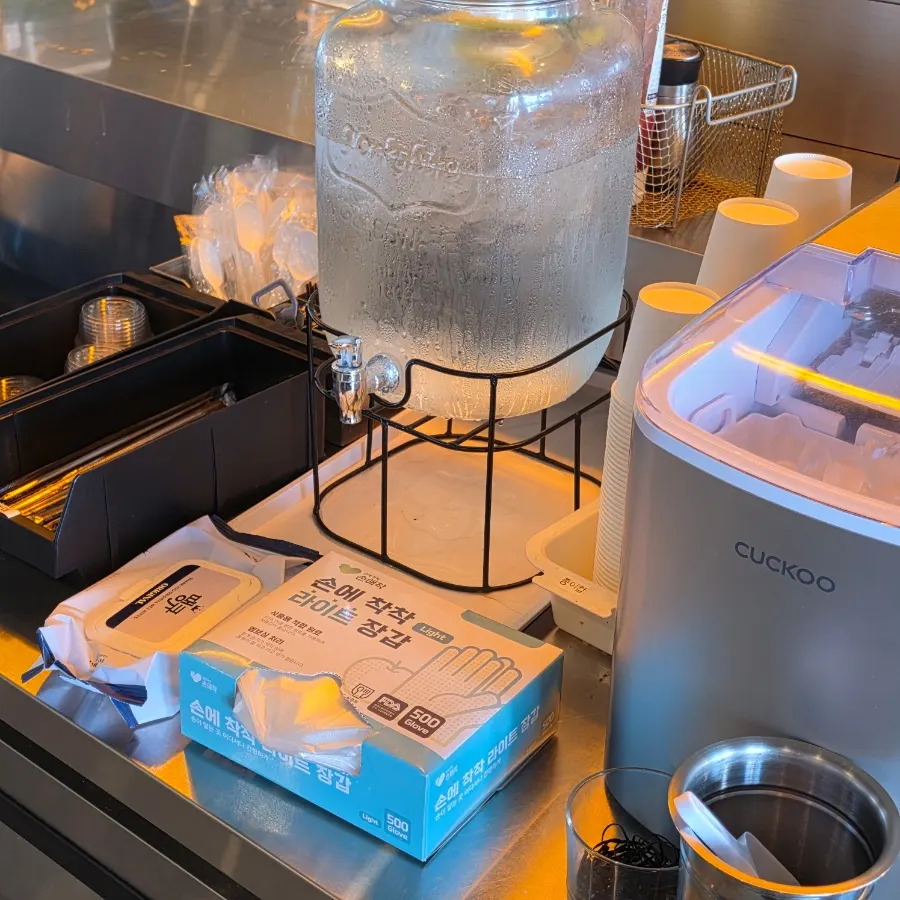 Self-bar stocked with hair ties and disposable gloves