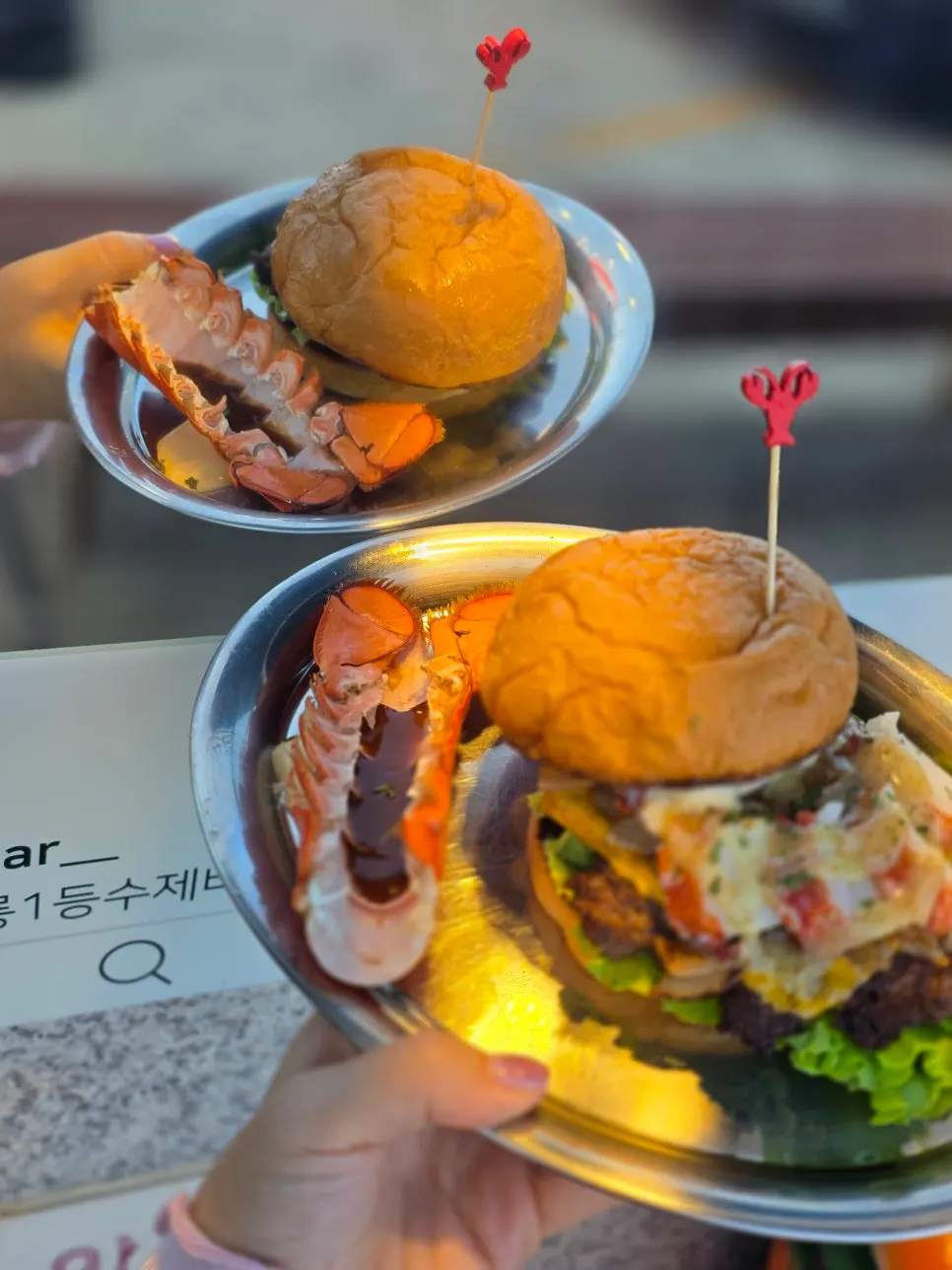 Enjoying a Gangneung handmade burger spread on the terrace