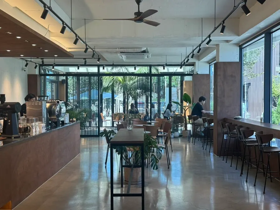 Indoor space at Coffee Dripper with widely spaced tables