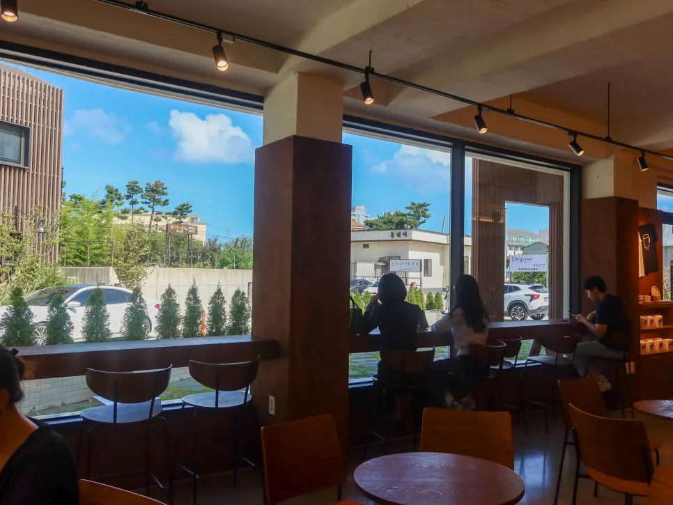 Interior of Coffee Dripper near the floor-to-ceiling windows