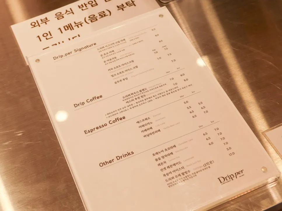 Drink and dessert menu board at Coffee Dripper