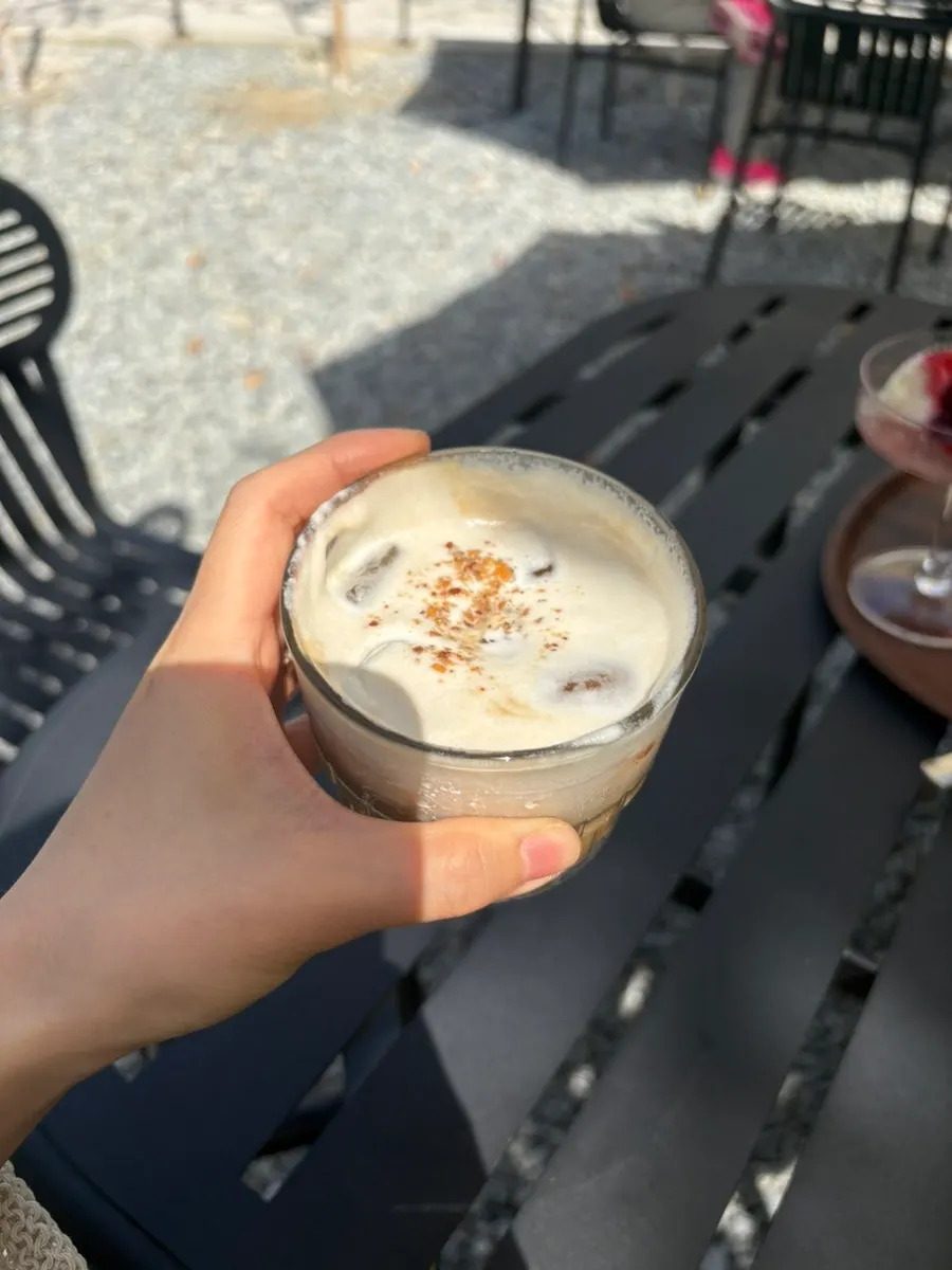 A cup of white almond mocha-style dripper latte