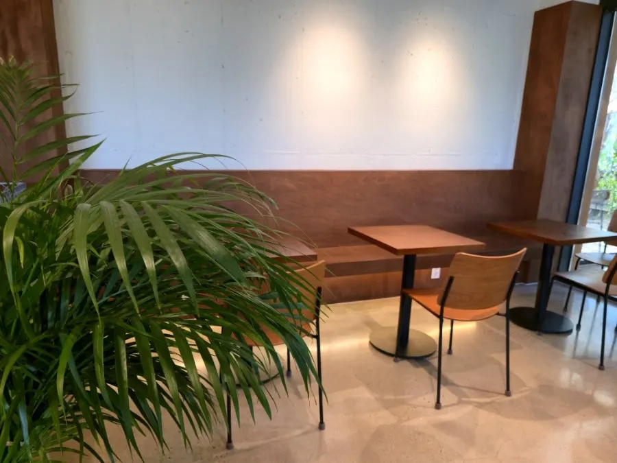 Spacious seating area with window-side tables