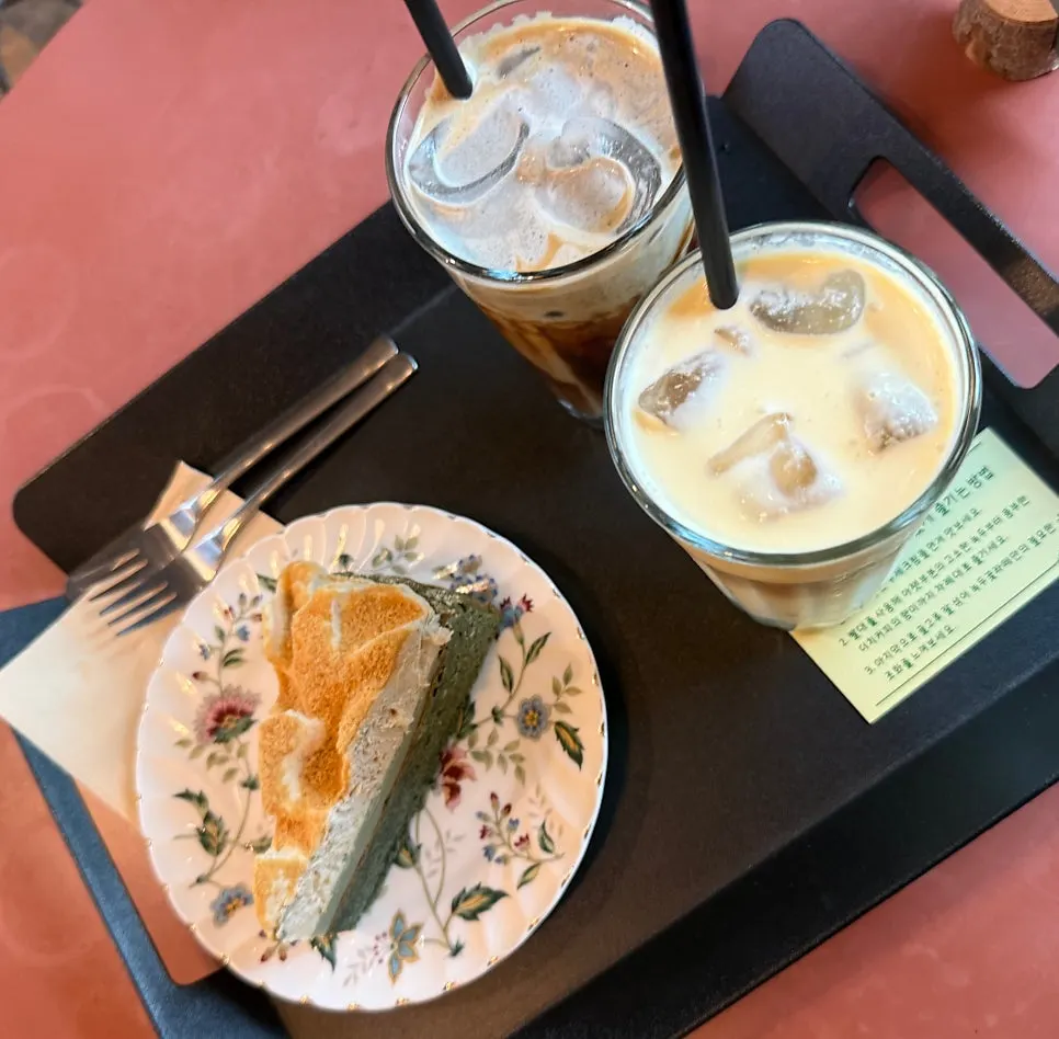 Latte and cake set on a table at Cafe Giwa