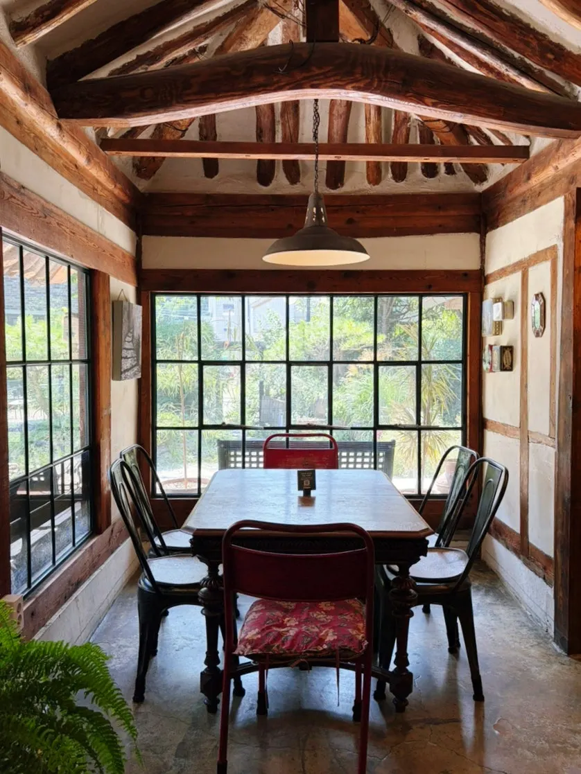 Cafe Giwa's interior with visible rafters and wooden structure