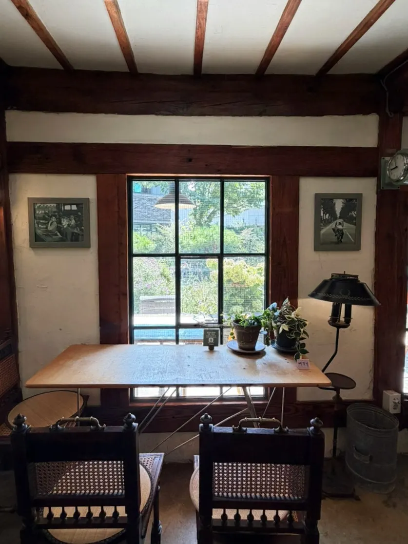 Cafe Giwa's interior with tables, lighting and small props arranged