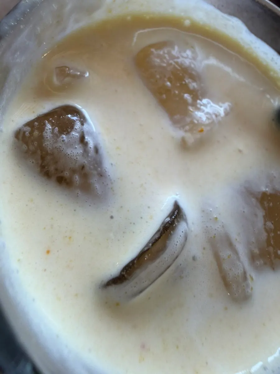 Cafe Giwa's mung bean flower latte topped with cream