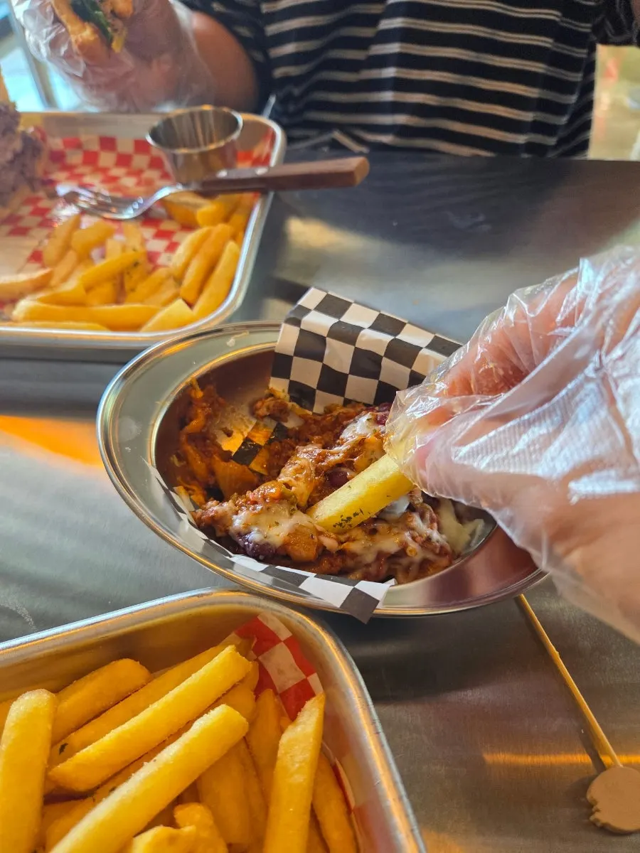 Fries dipped into chili bean sauce