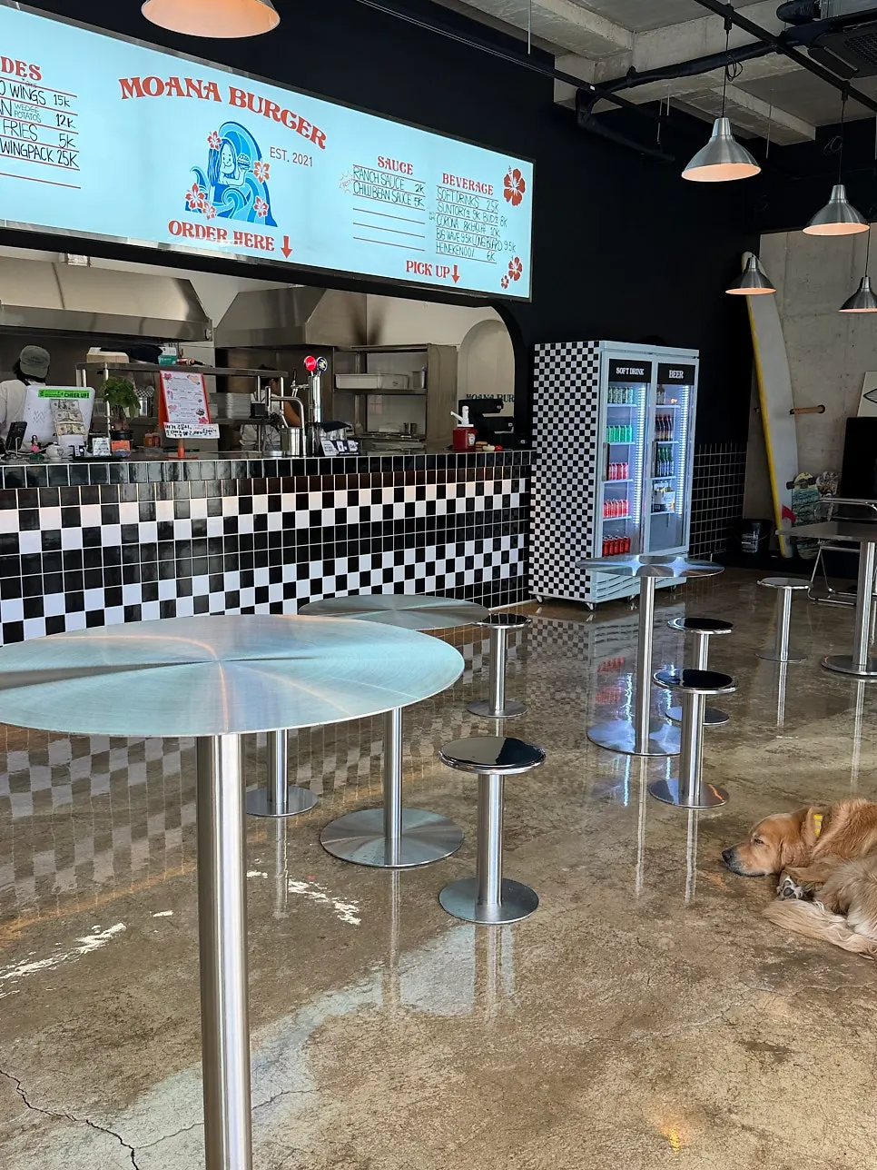 Interior with surfboards and skateboards placed around
