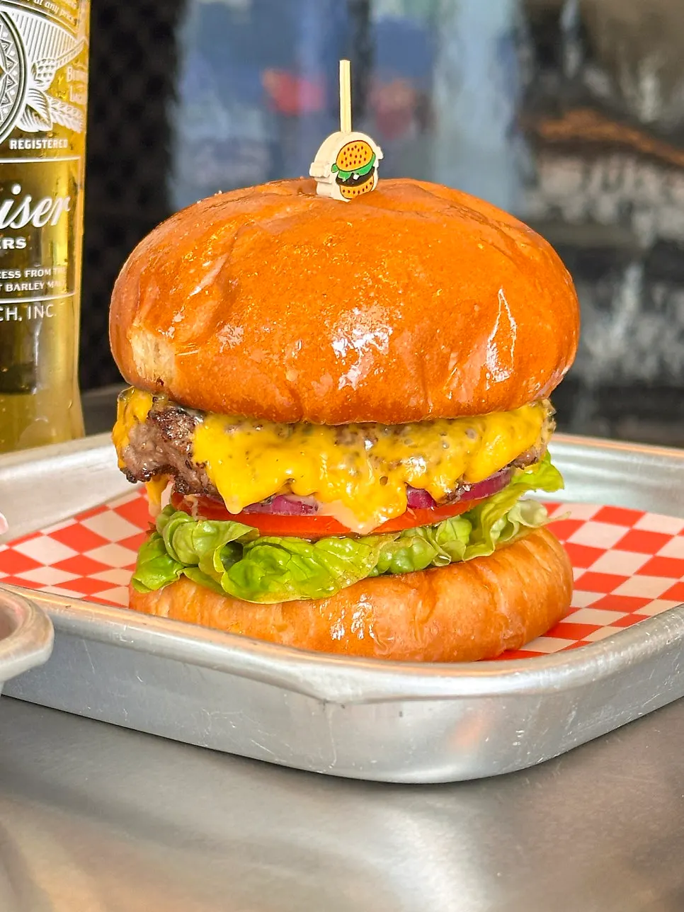 Handmade burger at Moana Burger focused on beef patty