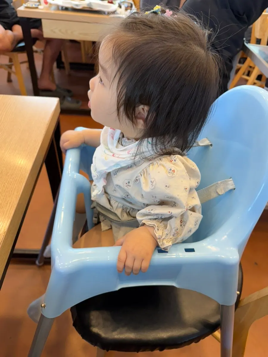 Baby chair set up for dining with an infant