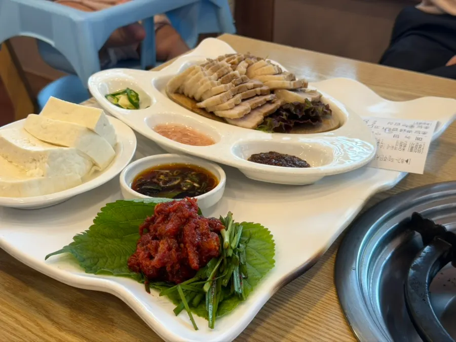 Bossam served alongside the table set