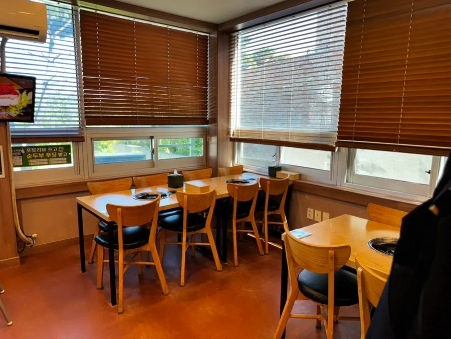 Interior seating at Jeong Eunsuk Chodang Sundubu with wide table spacing