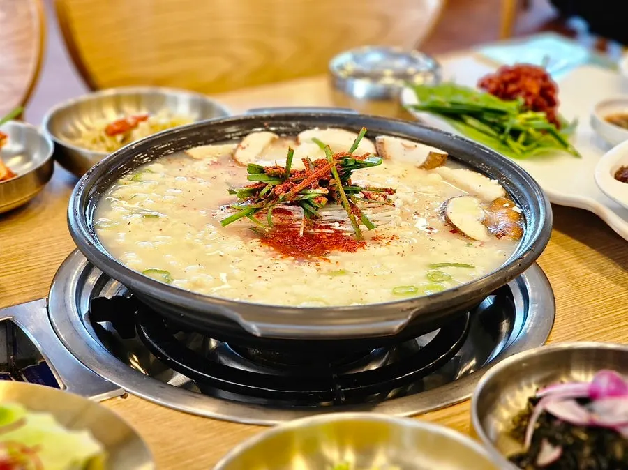 Myeongpum table with sundubu jjigae and boiled pork