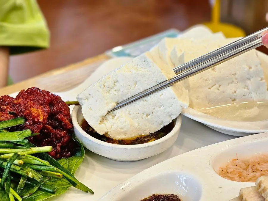 Tofu samhap plate with boiled pork, whole tofu, and gajami-sikhae