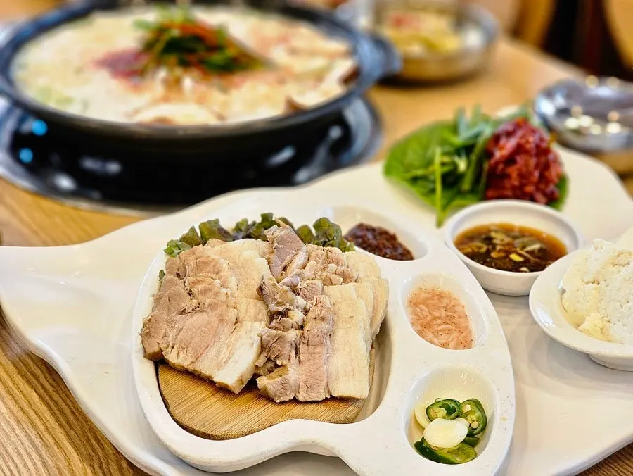 Boiled pork plated with salted shrimp and ssamjang